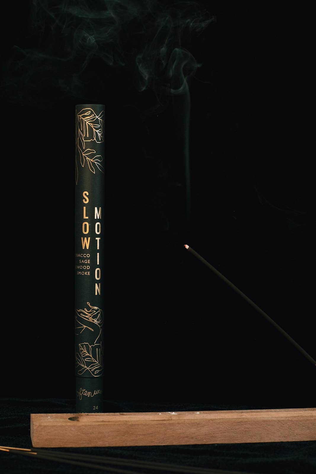 Book titled 'Slow Motion' with decorative elements on a dark background