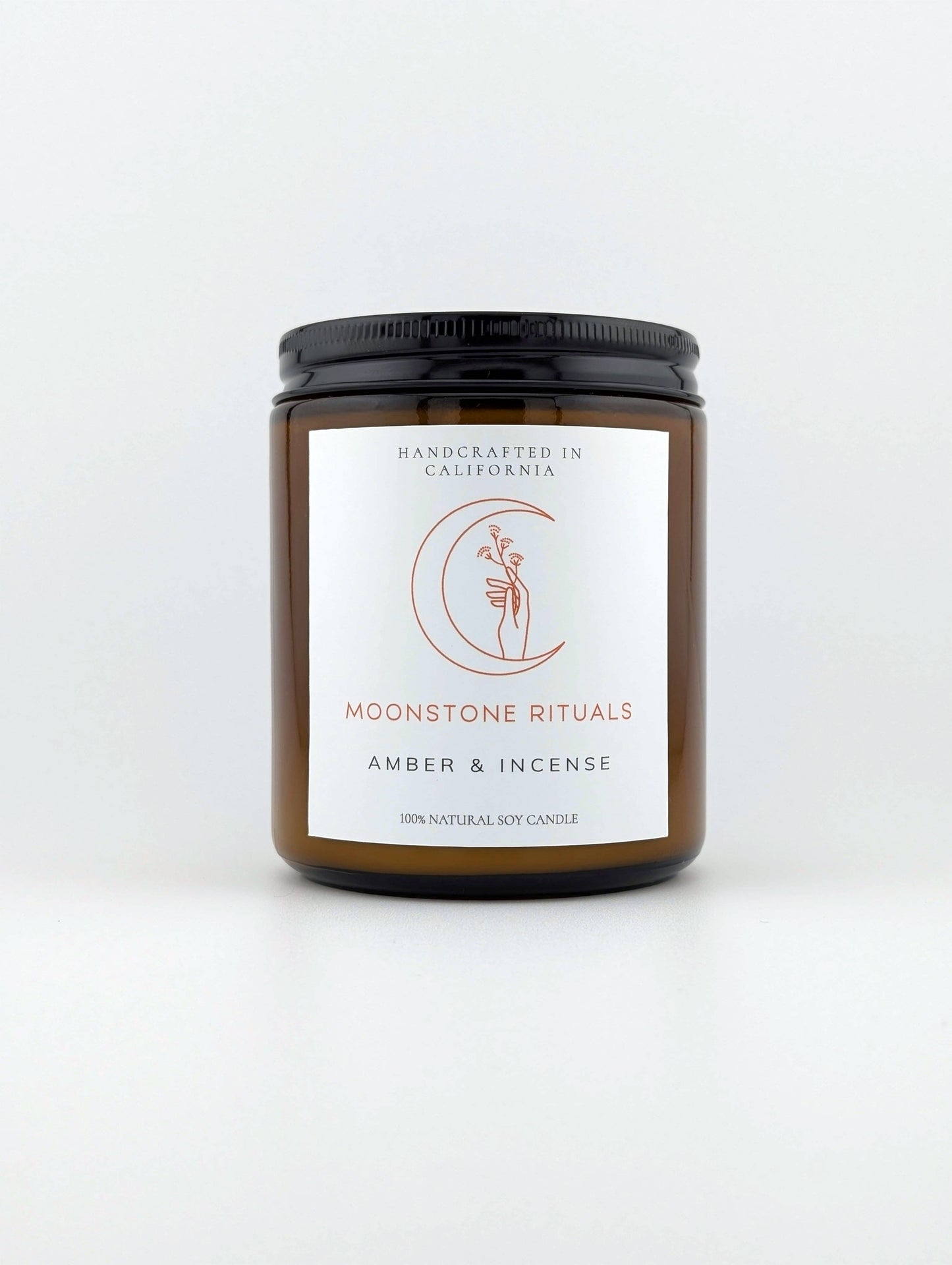 Candle jar with a label on a white background