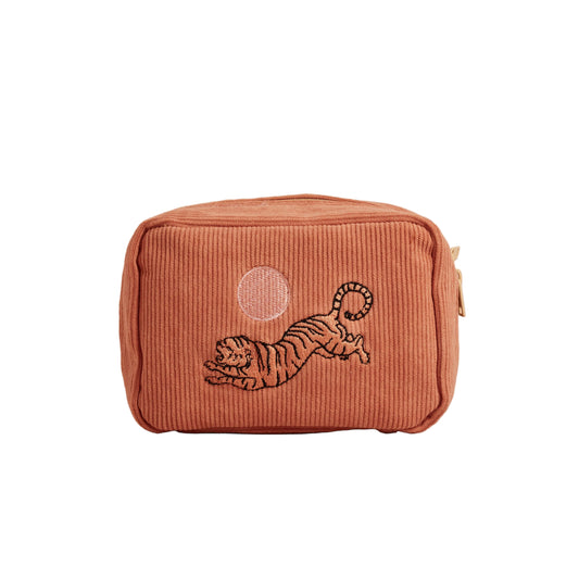 Corduroy pouch with embroidered tiger design on a beige background