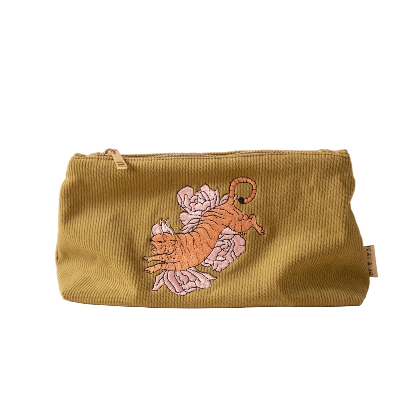 Green corduroy pouch with embroidered tiger and peony design on a beige background