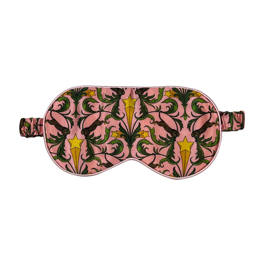 Sleep mask with pink floral pattern on a white background