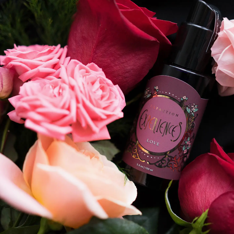 image of love aromatherapy mood spray displayed in a bed of red pink roses