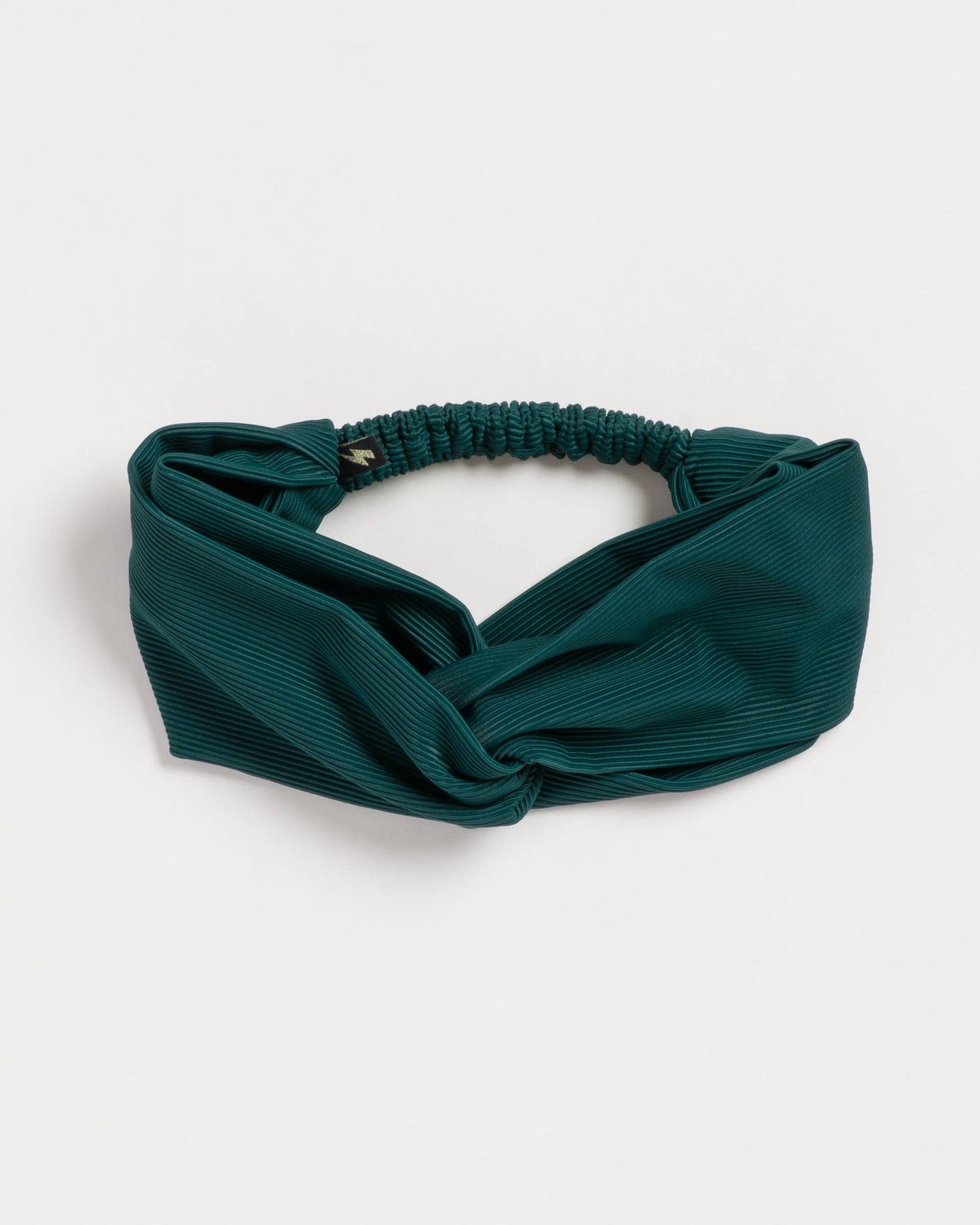 Green headband on a white background