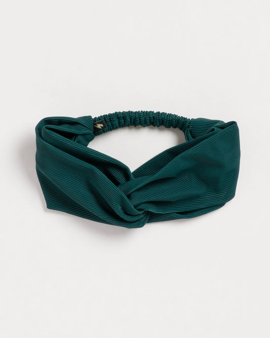Green headband on a white background