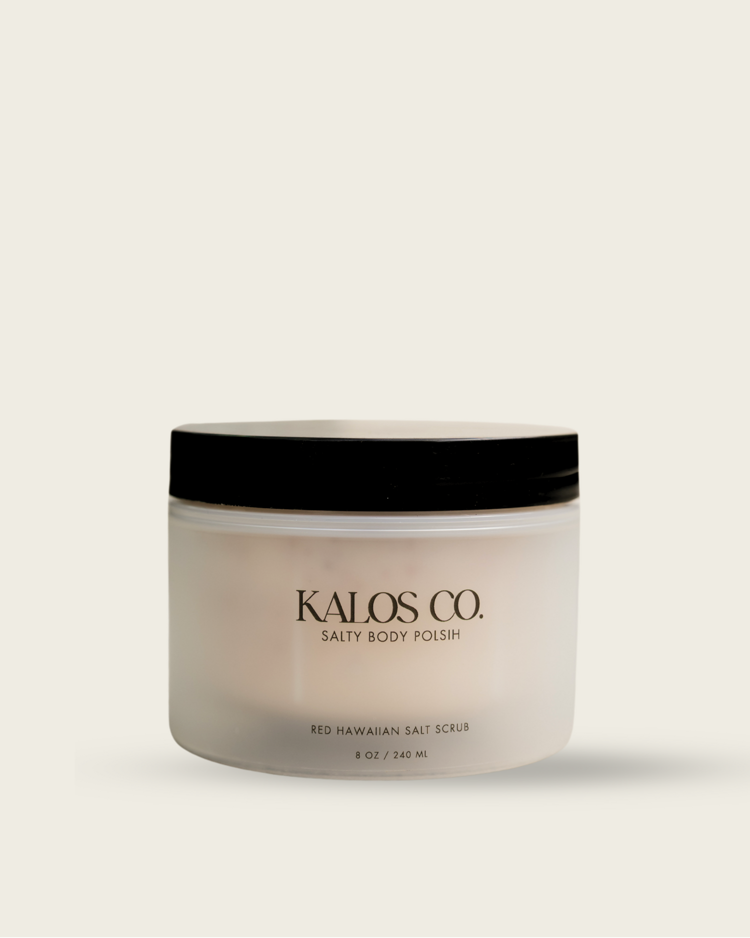 Jar of Kalos Co. body polish on a beige background