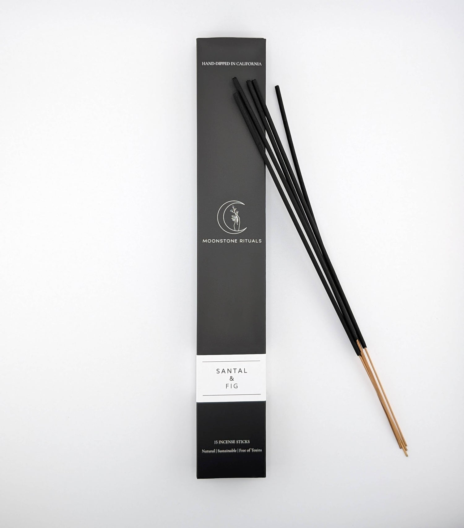 Black incense sticks with packaging on a white background