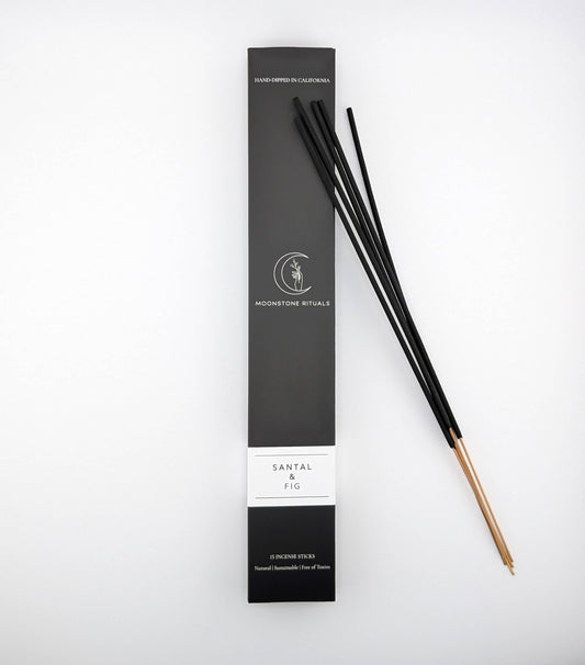 Black incense sticks with packaging on a white background