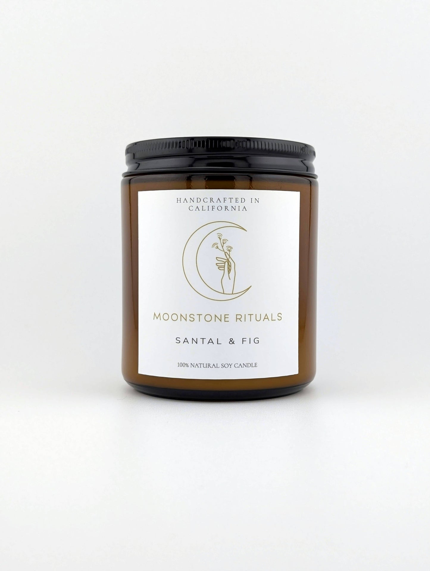 Candle jar with 'Moonstone Rituals' label on a white background