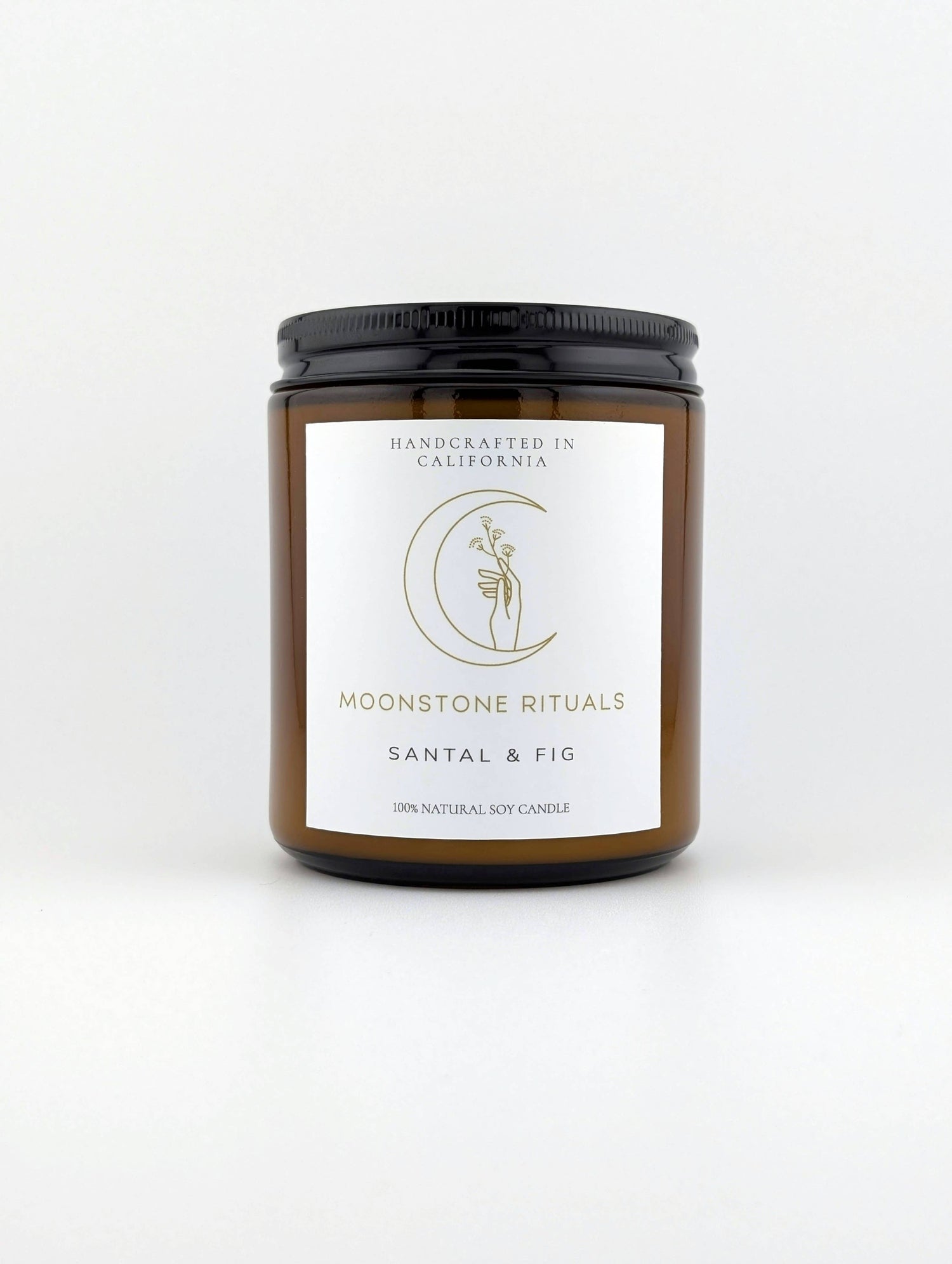 Candle jar with 'Moonstone Rituals' label on a white background