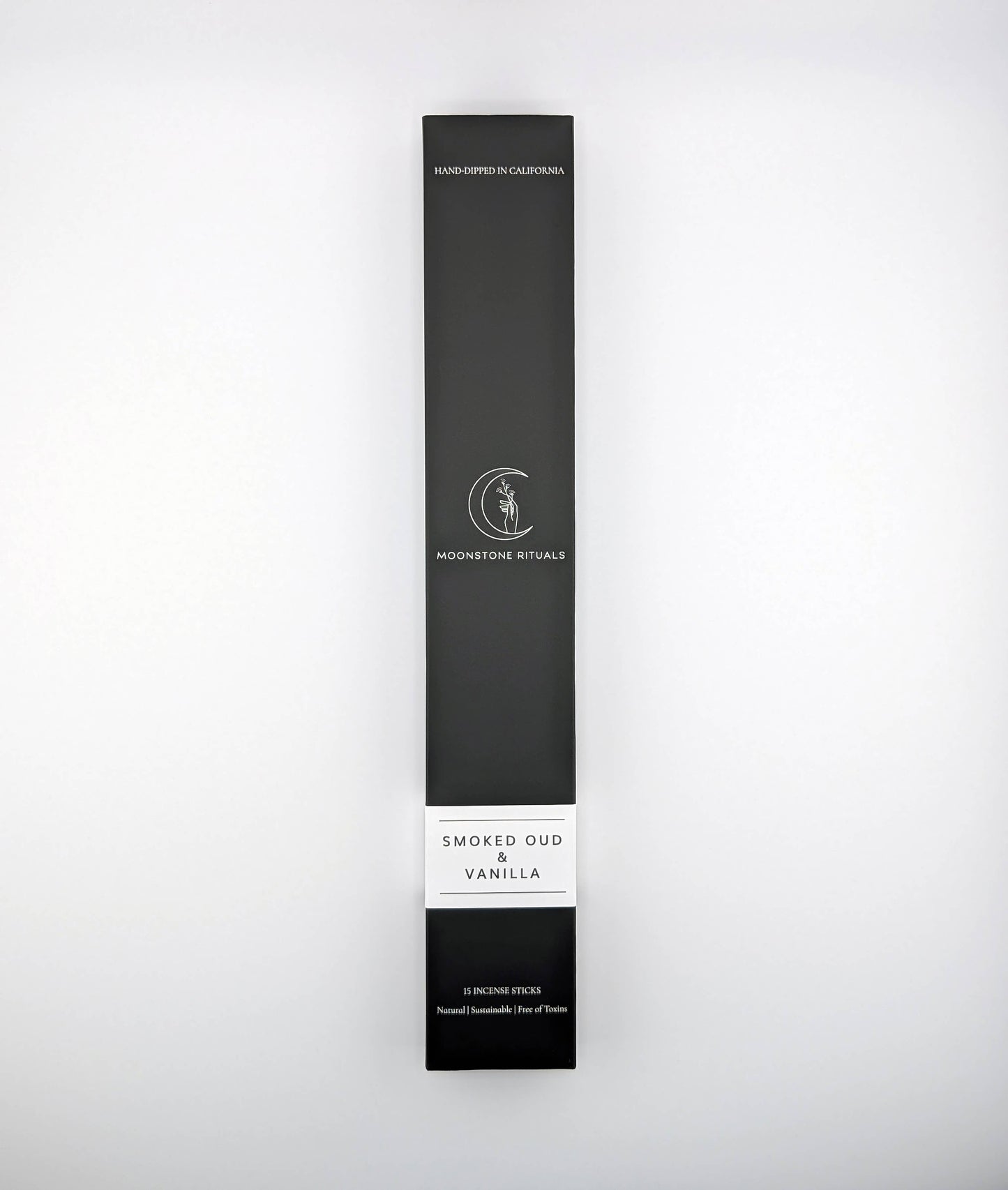 Black packaging box with 'Moonlit Rituals' branding on a white background