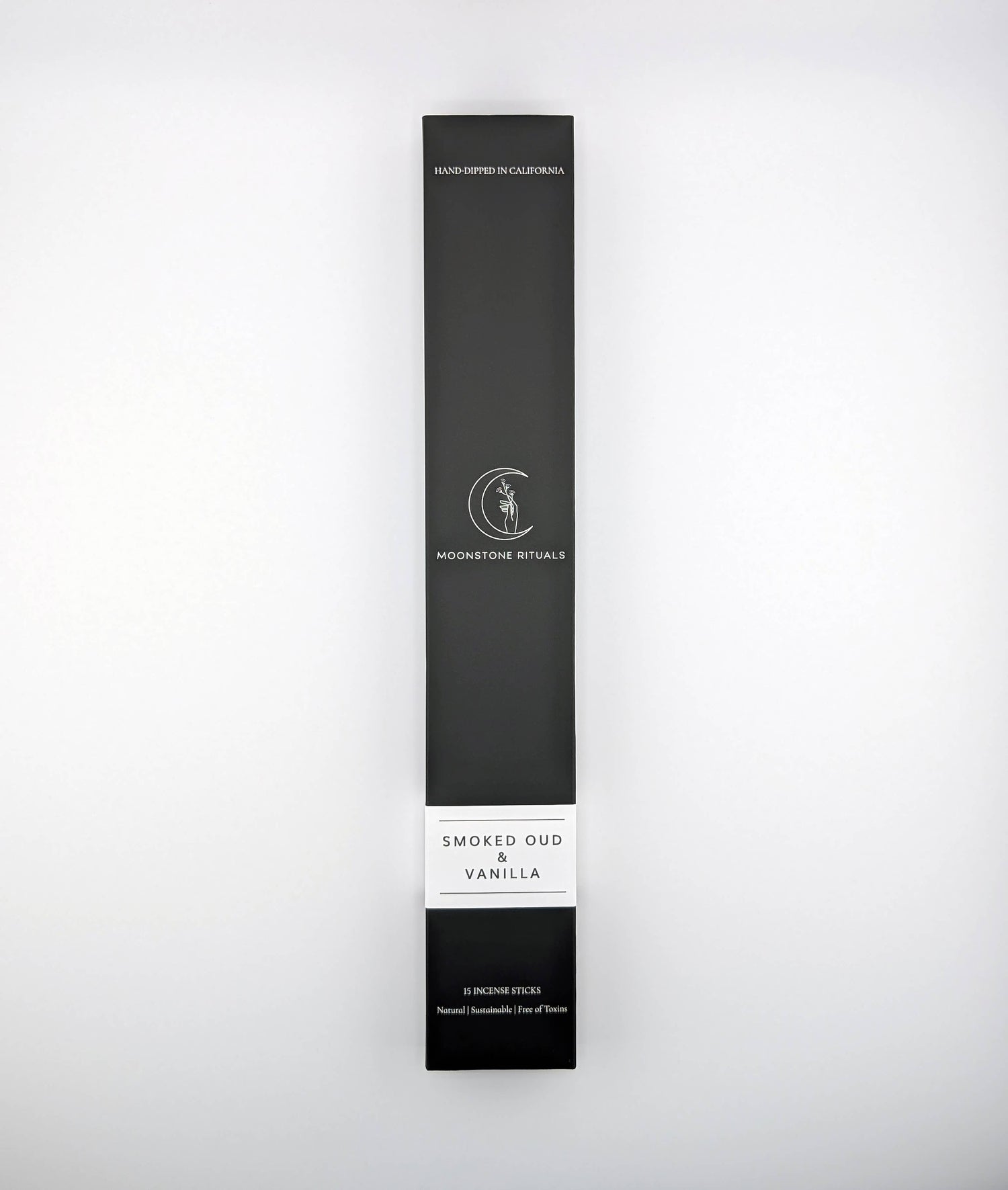 Black packaging box with 'Moonlit Rituals' branding on a white background