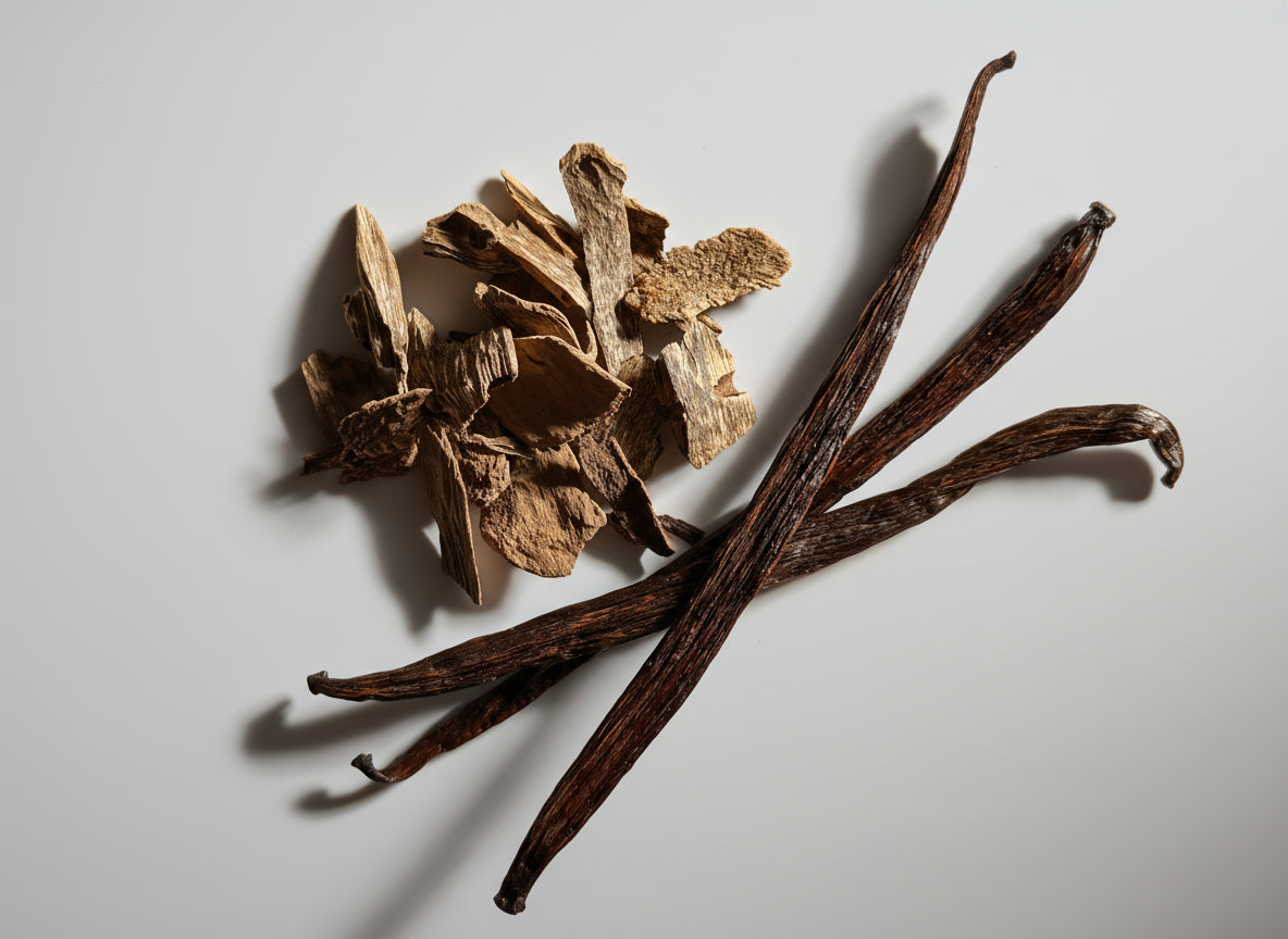 Vanilla beans and vanilla pod on a beige surface