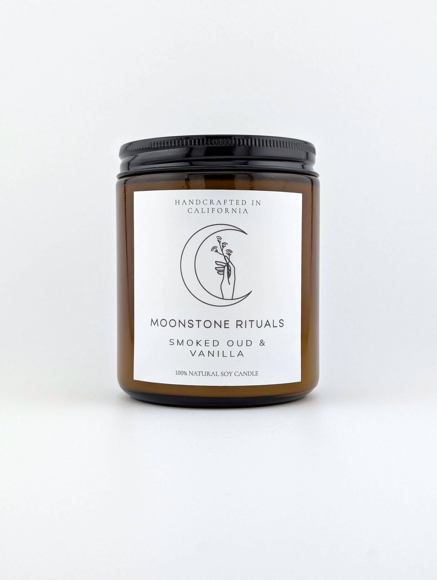 Moonstone Rituals candle with label on a white background