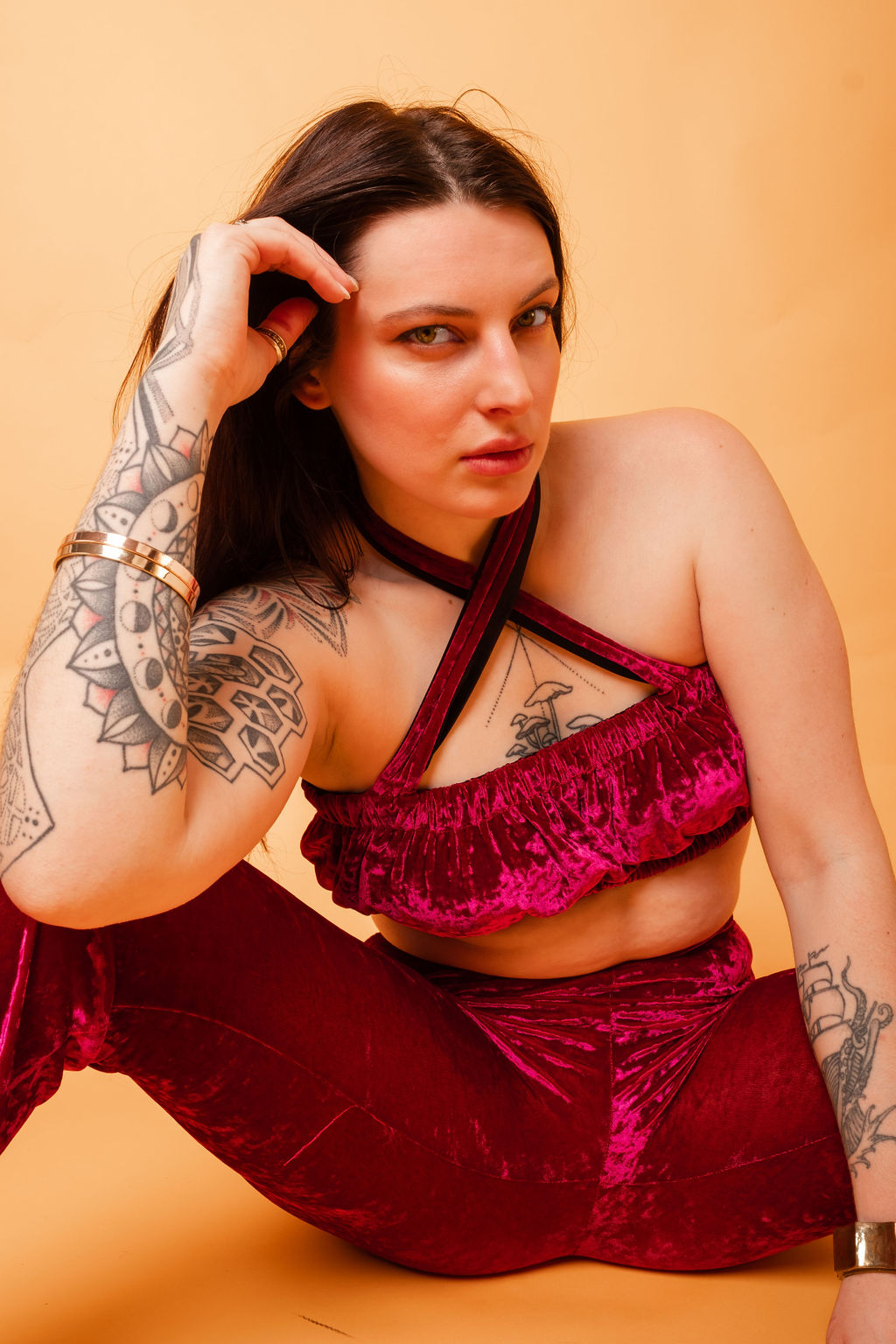 women is wearing The Cosmic Poppy Fuchsia Velvet Reversible Bandeau Halter Top