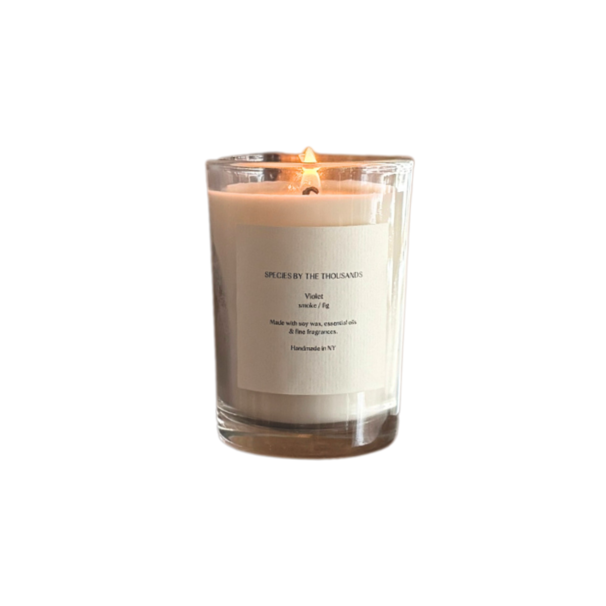 Lit candle against white background.